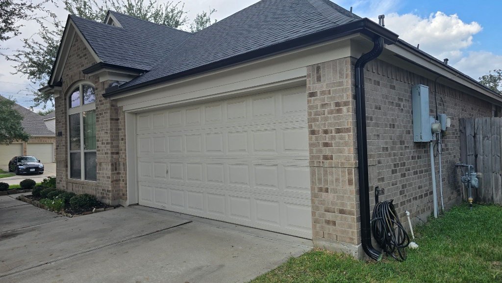 Gutters by CS Roofing Concepts &mdash; K-style gutters and downspouts, matte black